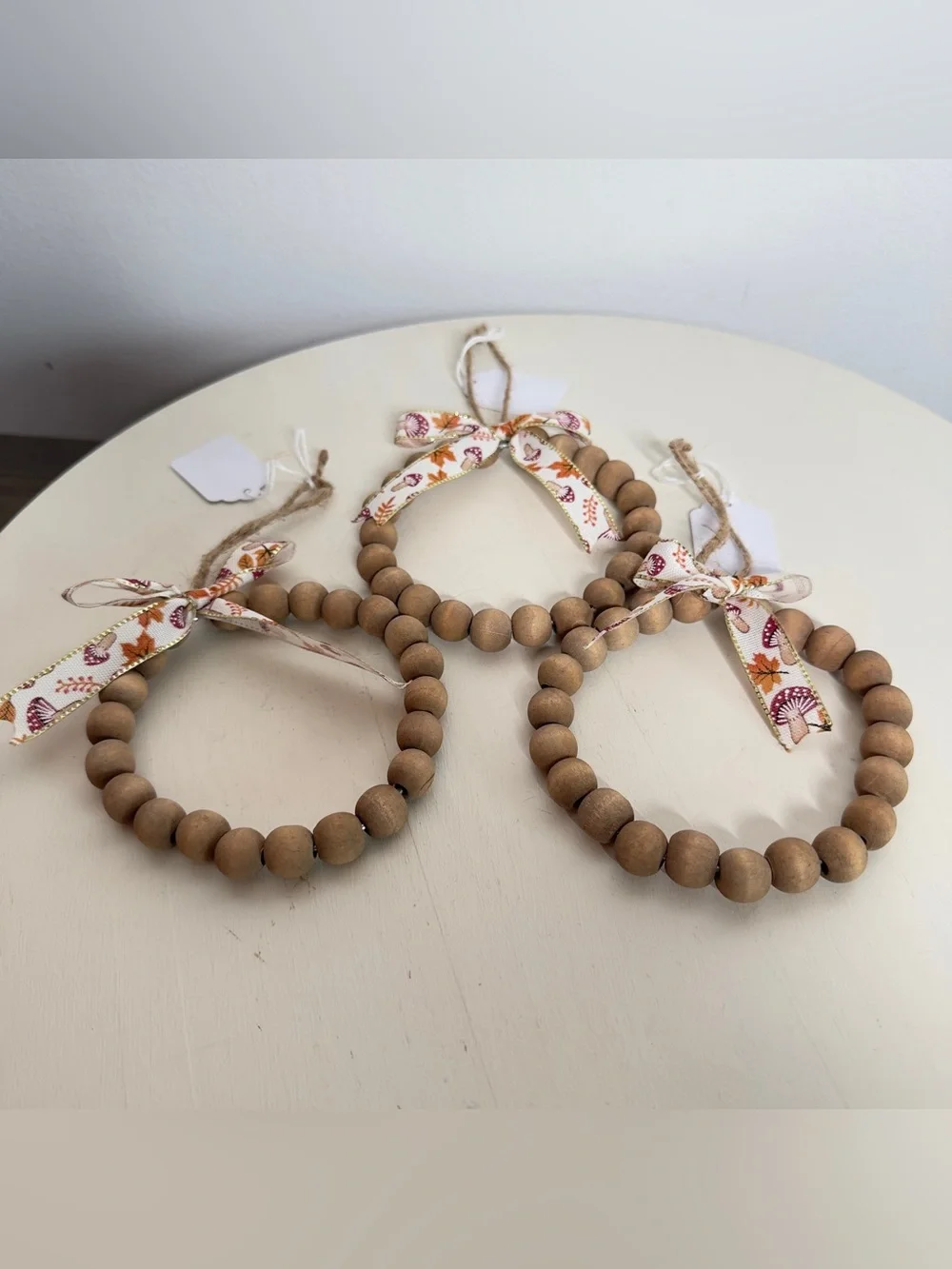3 Handmade Wood Beaded Wreath Ornament With Mushroom Print Bow